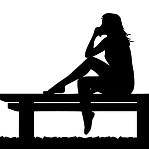 Silhouette Woman Sitting on Bench - Loneliness