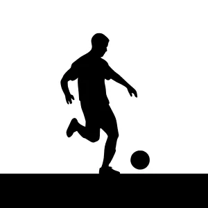 Silhouette Football Player Kicking Ball